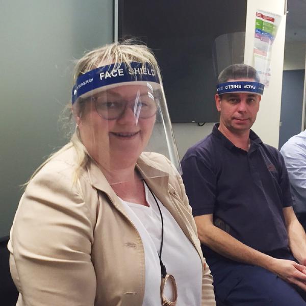 Kathy Dempsey wearing a face shield during a review session