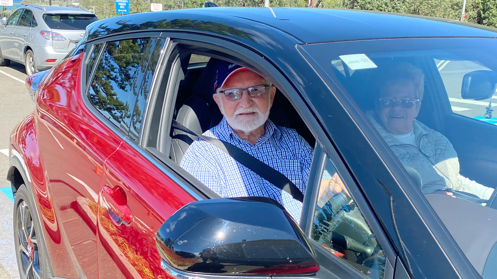 Ray Marshall arriving in his red car